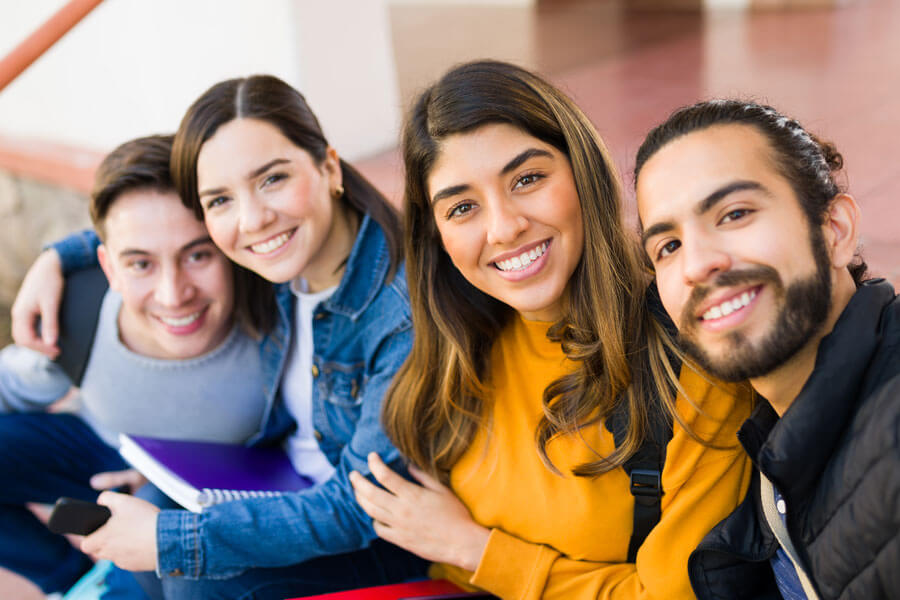 hispanic students smiling together