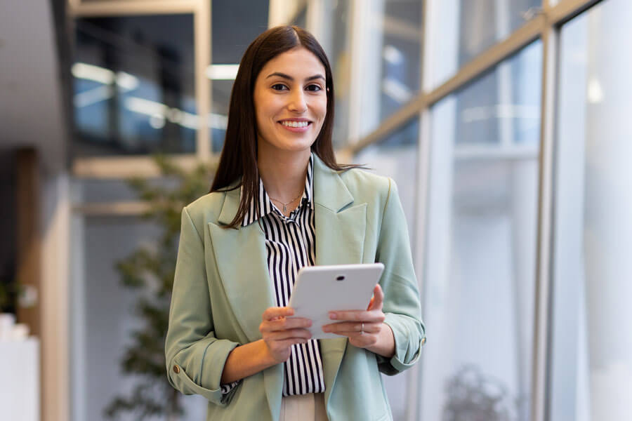 hispanic woman holding tablet in legal office
